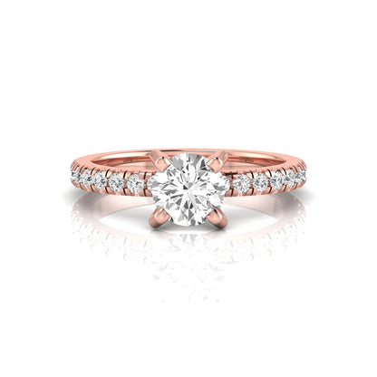 Round lab grown diamond pavé solitaire engagement ring featuring a 1.00 carat IGI certified round brilliant diamond with pavé diamond band in rose gold.