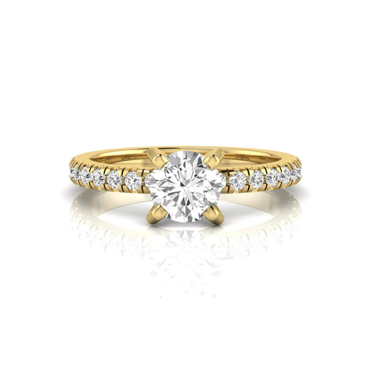 Round lab grown diamond pavé solitaire engagement ring featuring a 1.00 carat IGI certified round brilliant diamond with pavé diamond band in yellow gold.