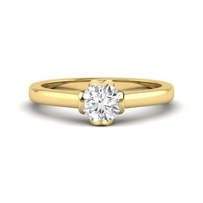 Round cut lab grown diamond solitaire engagement ring in yellow gold featuring a 1.03 carat IGI certified center diamond.
