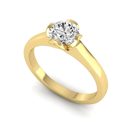 Round cut lab grown diamond solitaire engagement ring in yellow gold featuring a 1.03 carat IGI certified center diamond.