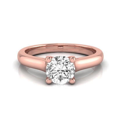 Round lab grown diamond solitaire engagement ring featuring a 0.65 carat round brilliant diamond in a classic four-prong rose gold setting.