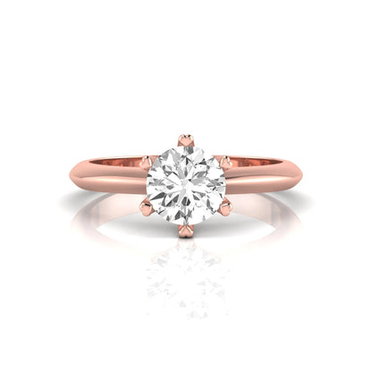 Rose-gold ring with a diamond on a white background