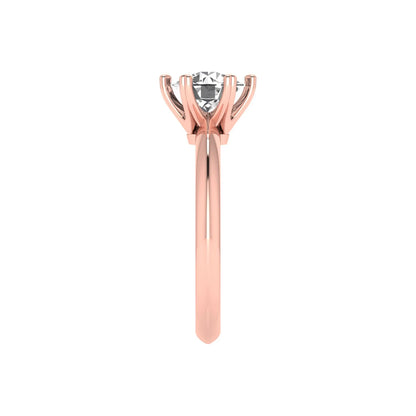 Rose-gold ring with a diamond on a white background