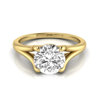 Round cut lab grown diamond split shank solitaire engagement ring featuring a 1.55 carat IGI certified center diamond in yellow gold.