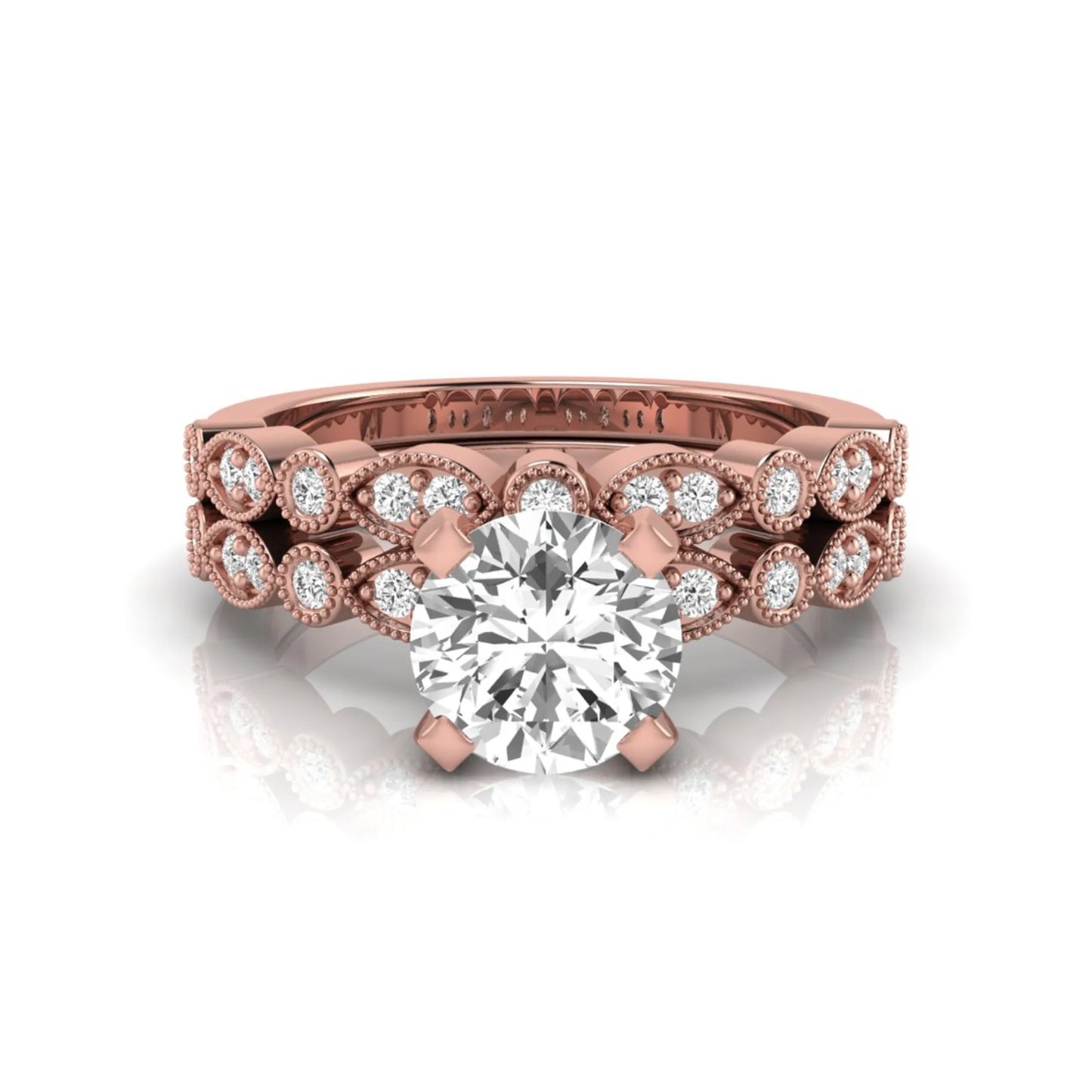Round milgrain vintage lab grown diamond bridal ring set featuring a 1.28 carat IGI certified round center diamond with matching vintage-inspired diamond wedding band in a rose gold design.
