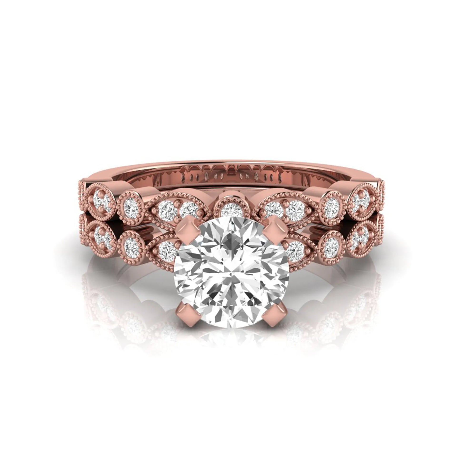 Round milgrain vintage lab grown diamond bridal ring set featuring a 1.28 carat IGI certified round center diamond with matching vintage-inspired diamond wedding band in a rose gold design.