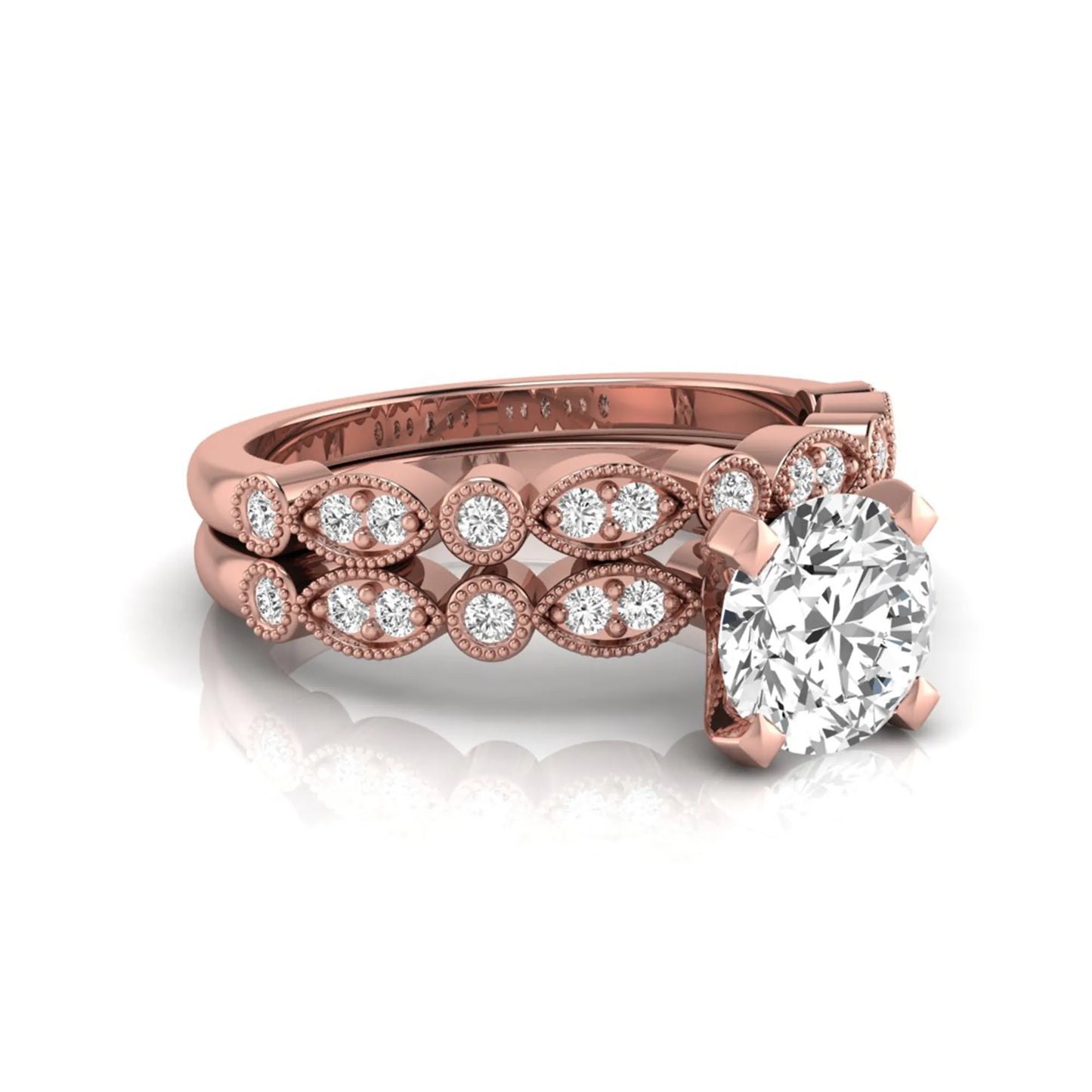 Round milgrain vintage lab grown diamond bridal ring set featuring a 1.28 carat IGI certified round center diamond with matching vintage-inspired diamond wedding band in a rose gold design.