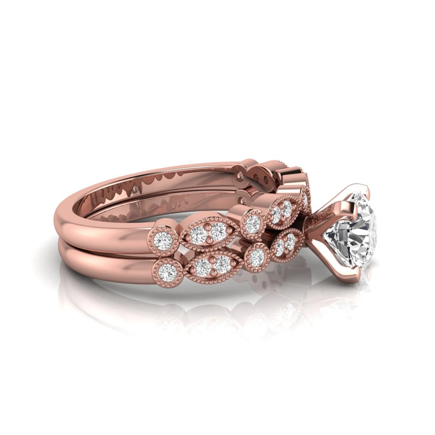 Round milgrain vintage lab grown diamond bridal ring set featuring a 1.28 carat IGI certified round center diamond with matching vintage-inspired diamond wedding band in a rose gold design.