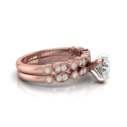 Round milgrain vintage lab grown diamond bridal ring set featuring a 1.28 carat IGI certified round center diamond with matching vintage-inspired diamond wedding band in a rose gold design.