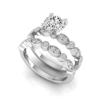 Round milgrain vintage lab grown diamond bridal ring set featuring a 1.28 carat IGI certified round center diamond with matching vintage-inspired diamond wedding band in a white gold design.