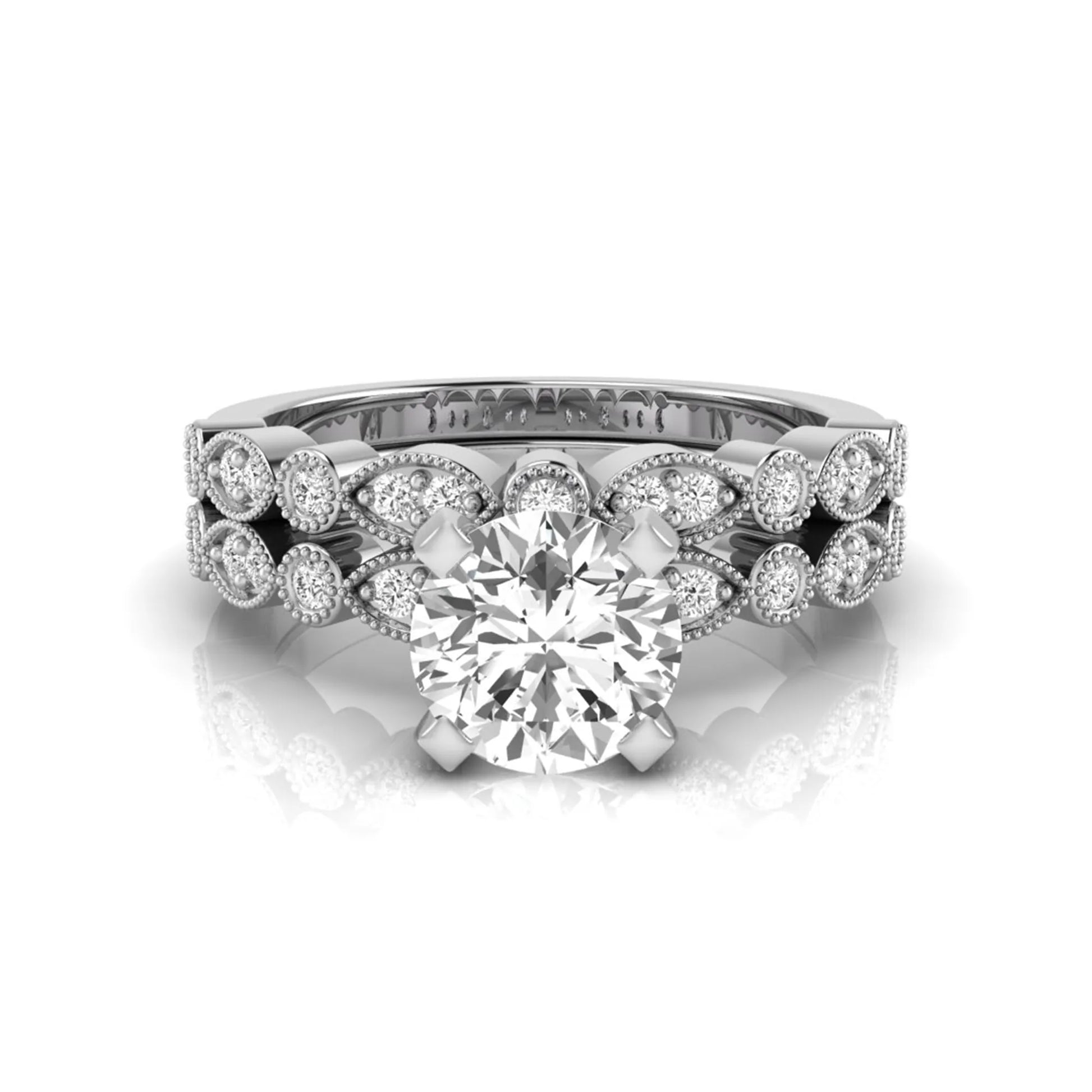 Round milgrain vintage lab grown diamond bridal ring set featuring a 1.28 carat IGI certified round center diamond with matching vintage-inspired diamond wedding band in a white gold design.