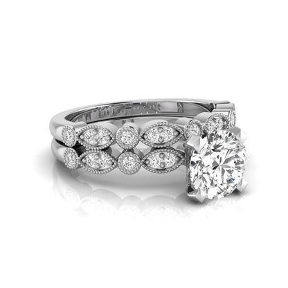 Round milgrain vintage lab grown diamond bridal ring set featuring a 1.28 carat IGI certified round center diamond with matching vintage-inspired diamond wedding band in a white gold design.