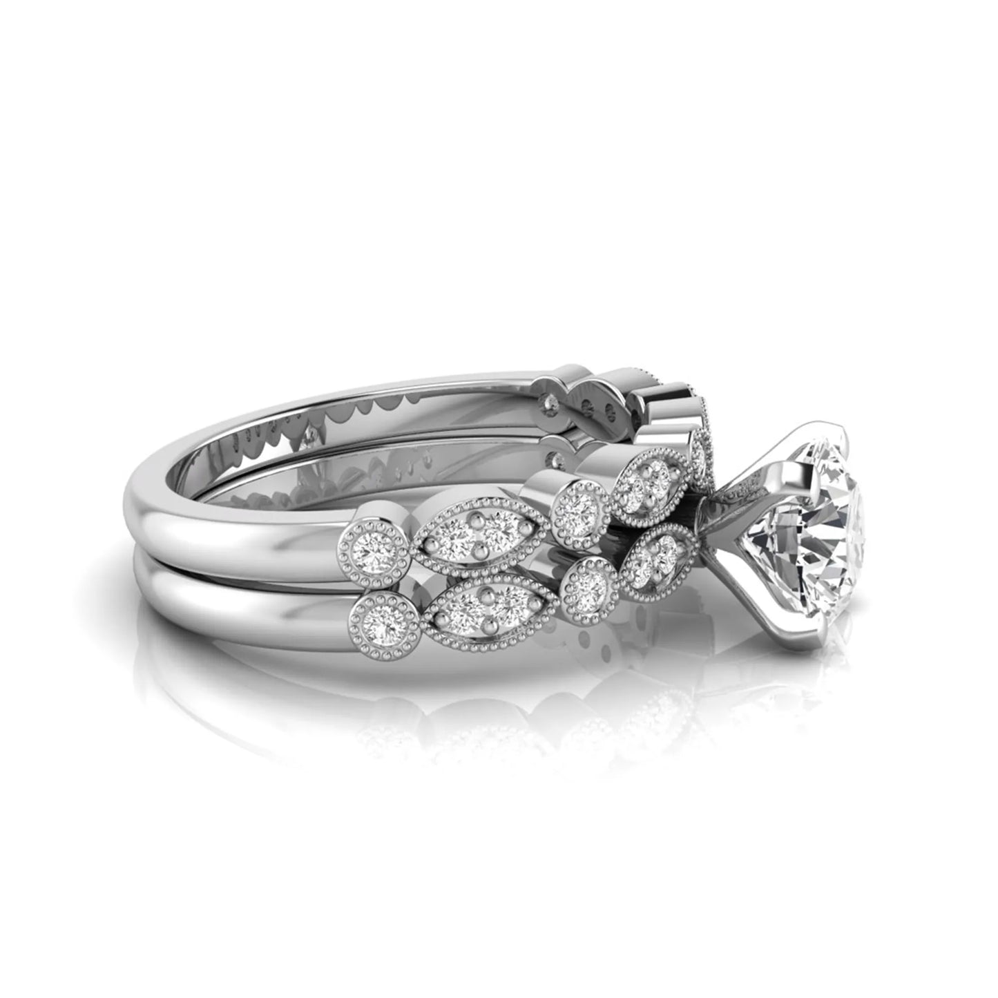 Round milgrain vintage lab grown diamond bridal ring set featuring a 1.28 carat IGI certified round center diamond with matching vintage-inspired diamond wedding band in a white gold design.