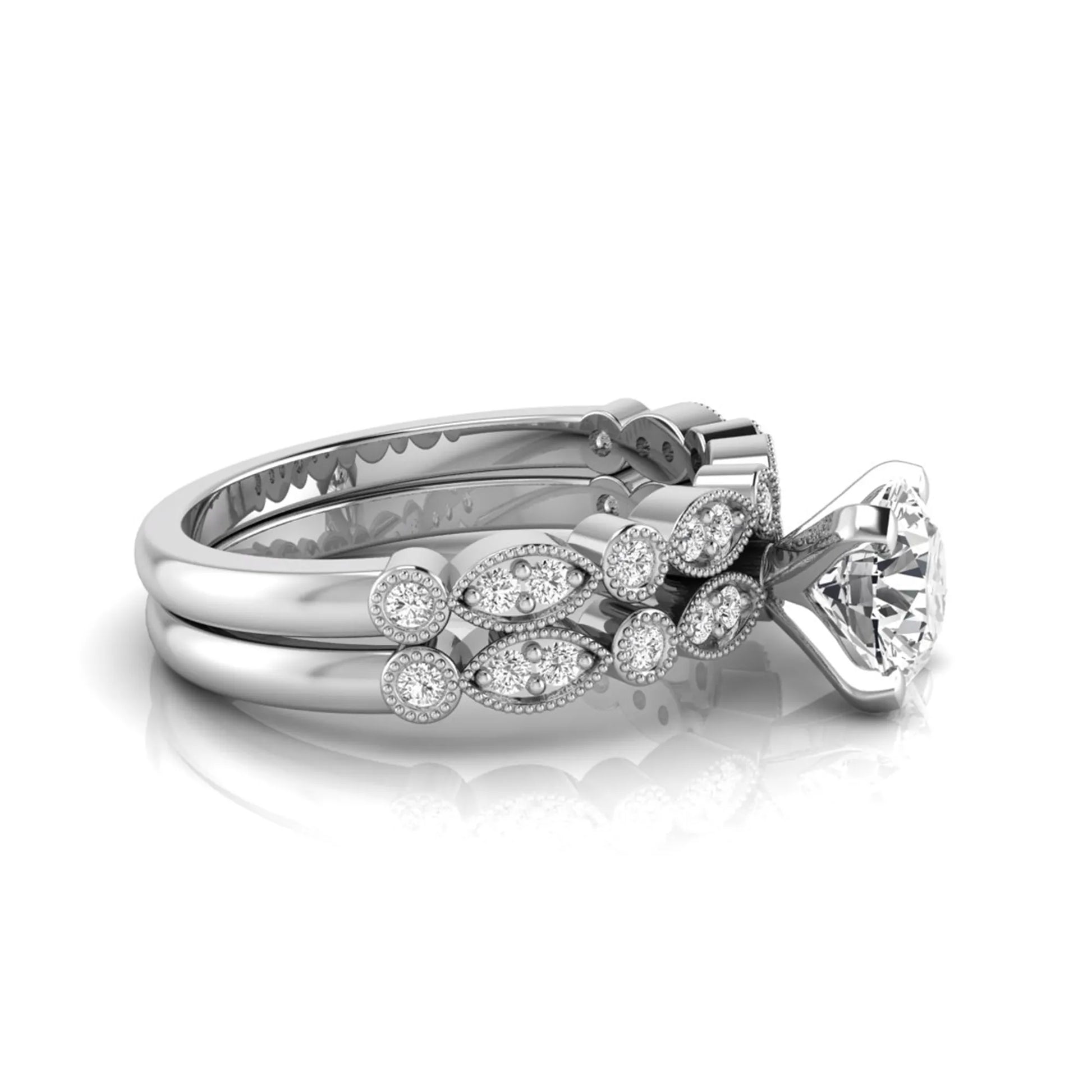 Round milgrain vintage lab grown diamond bridal ring set featuring a 1.28 carat IGI certified round center diamond with matching vintage-inspired diamond wedding band in a white gold design.