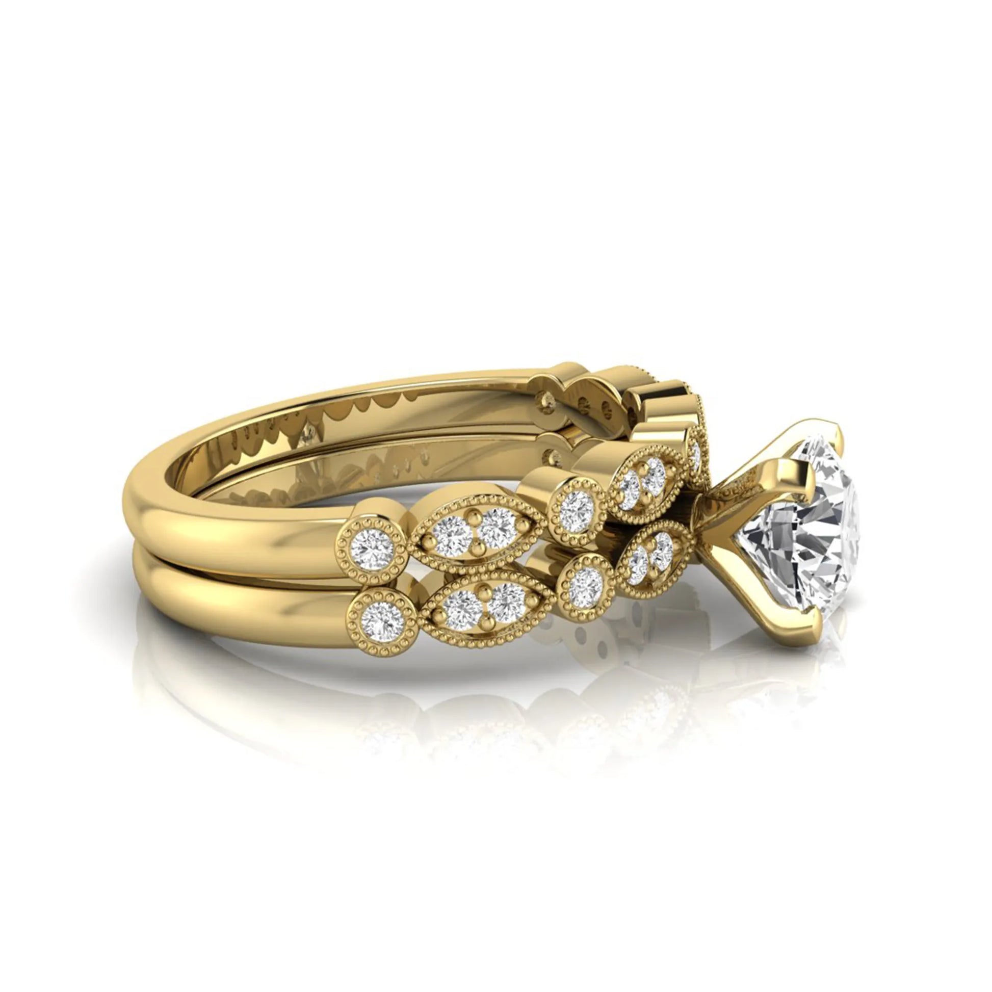 Round milgrain vintage lab grown diamond bridal ring set featuring a 1.28 carat IGI certified round center diamond with matching vintage-inspired diamond wedding band in a yellow gold design.