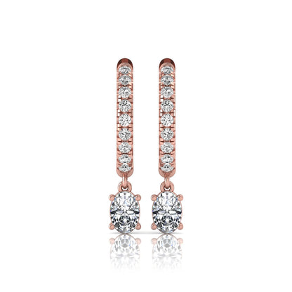 Round and oval cut lab grown diamond pavé drop huggie hoop earrings featuring sparkling round diamonds on the hoop, an oval diamond drop, hinged snap closure, and polished rose gold tone finish.