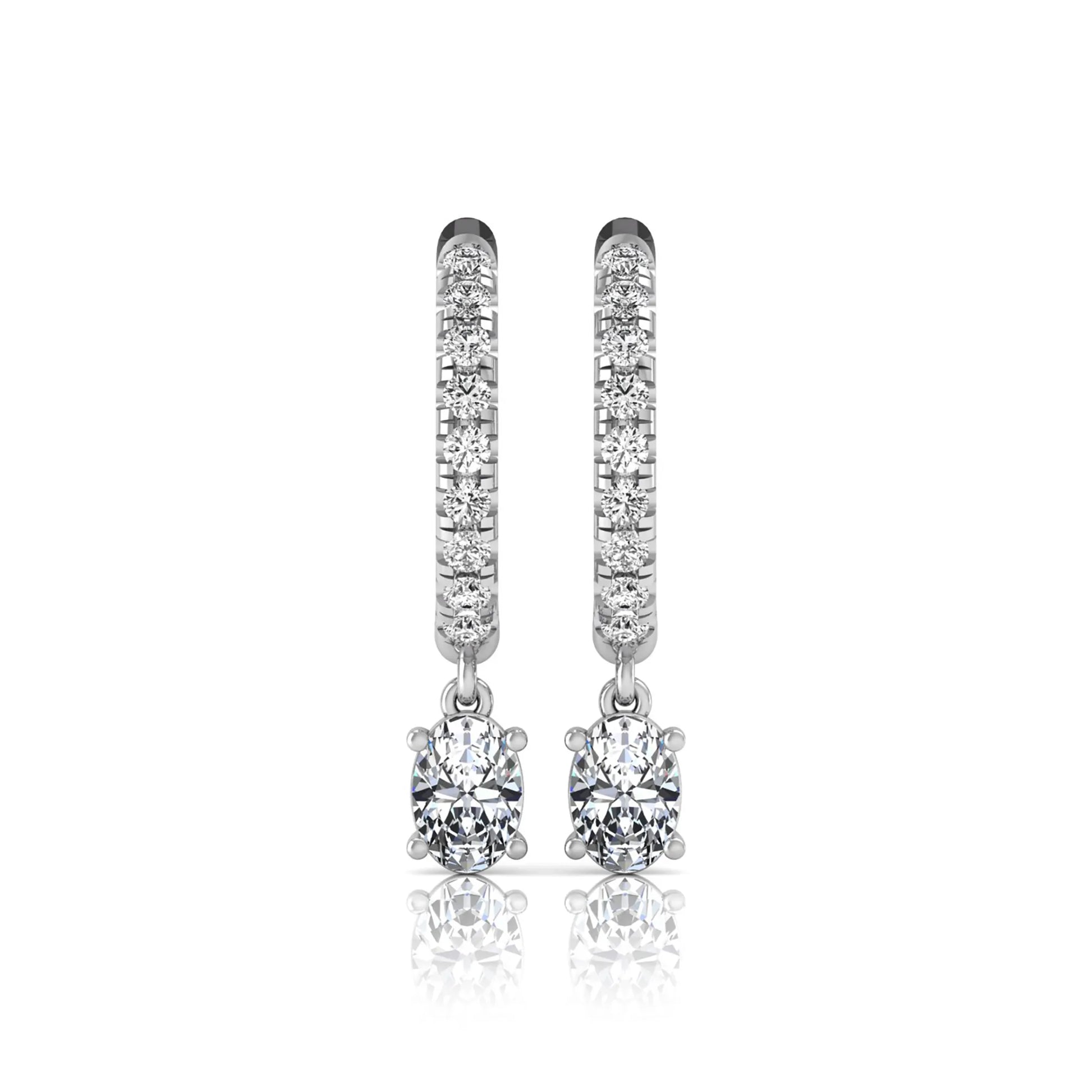 Round and oval cut lab grown diamond pavé drop huggie hoop earrings featuring sparkling round diamonds on the hoop, an oval diamond drop, hinged snap closure, and polished white gold tone finish.