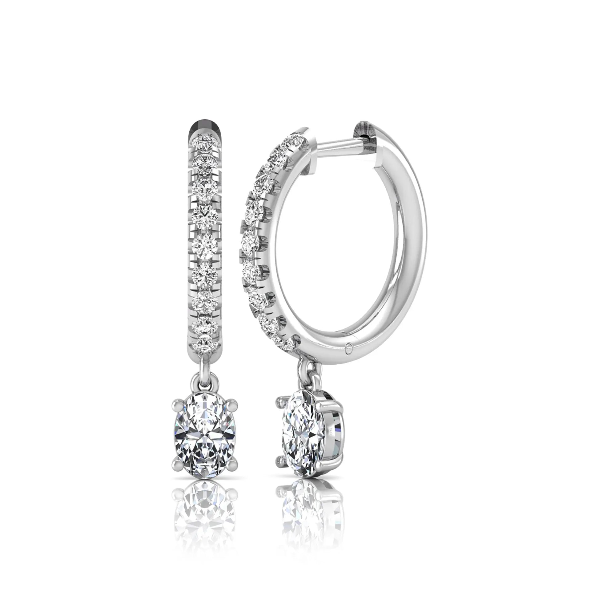 Round and oval cut lab grown diamond pavé drop huggie hoop earrings featuring sparkling round diamonds on the hoop, an oval diamond drop, hinged snap closure, and polished white gold tone finish.