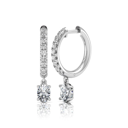 Round and oval cut lab grown diamond pavé drop huggie hoop earrings featuring sparkling round diamonds on the hoop, an oval diamond drop, hinged snap closure, and polished white gold tone finish.