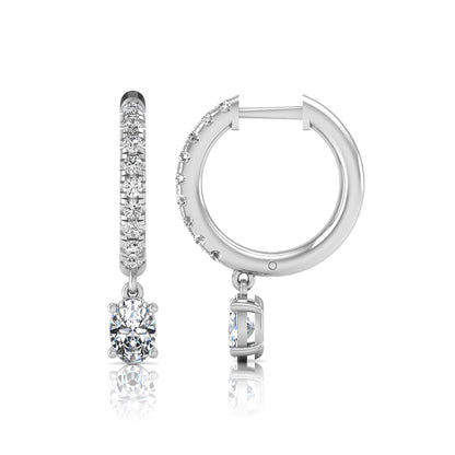 Round and oval cut lab grown diamond pavé drop huggie hoop earrings featuring sparkling round diamonds on the hoop, an oval diamond drop, hinged snap closure, and polished white gold tone finish.