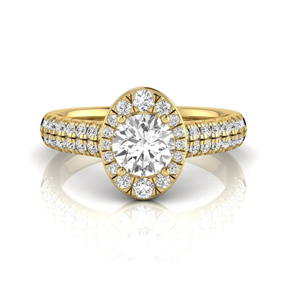 Round cut lab grown diamond engagement ring with an oval-shaped halo, double pavé side stones, and a yellow gold style band.