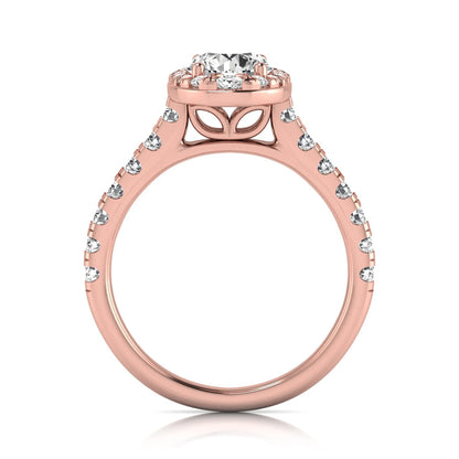 Round cut lab grown diamond engagement ring with an oval-shaped halo of round diamonds, pavé side stones, and a rose gold style band.
