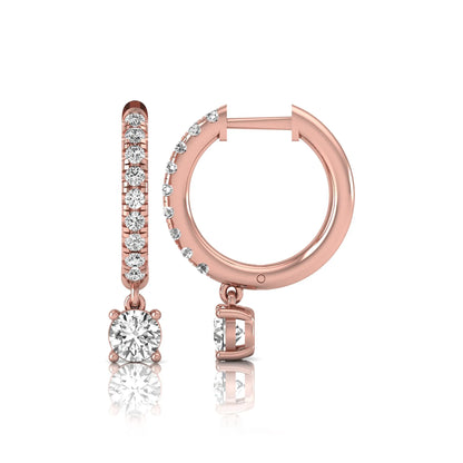 Round cut lab grown diamond pavé drop huggie hoop earrings featuring a brilliant round solitaire diamond, sparkling pavé diamonds, hinged snap closure, and polished rose gold finish.