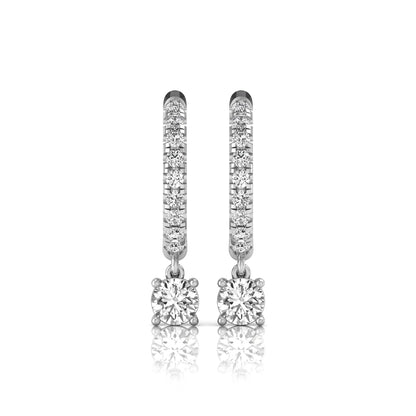Round cut lab grown diamond pavé drop huggie hoop earrings featuring a brilliant round solitaire diamond, sparkling pavé diamonds, hinged snap closure, and polished white gold finish.