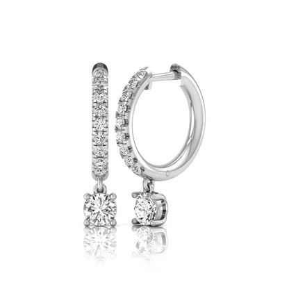 Round cut lab grown diamond pavé drop huggie hoop earrings featuring a brilliant round solitaire diamond, sparkling pavé diamonds, hinged snap closure, and polished white gold finish.