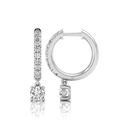 Round cut lab grown diamond pavé drop huggie hoop earrings featuring a brilliant round solitaire diamond, sparkling pavé diamonds, hinged snap closure, and polished white gold finish.