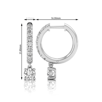 Round cut lab grown diamond pavé drop huggie hoop earrings featuring a brilliant round solitaire diamond, sparkling pavé diamonds, hinged snap closure, and polished white gold finish.