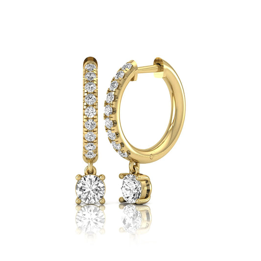 Round cut lab grown diamond pavé drop huggie hoop earrings featuring a brilliant round solitaire diamond, sparkling pavé diamonds, hinged snap closure, and polished yellow gold finish.