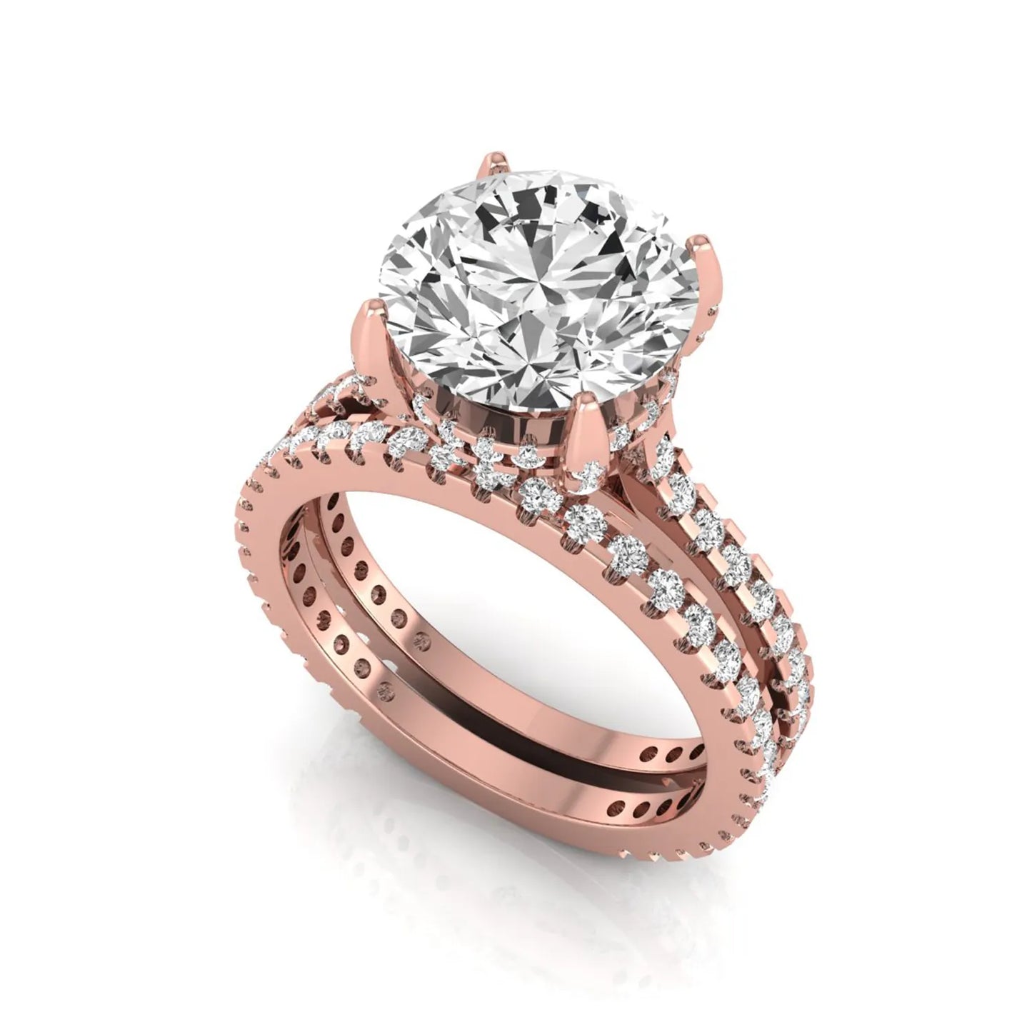 Round cut lab grown diamond bridal ring set featuring an IGI certified center diamond with matching pavé diamond wedding band in a classic four-prong setting in rose gold