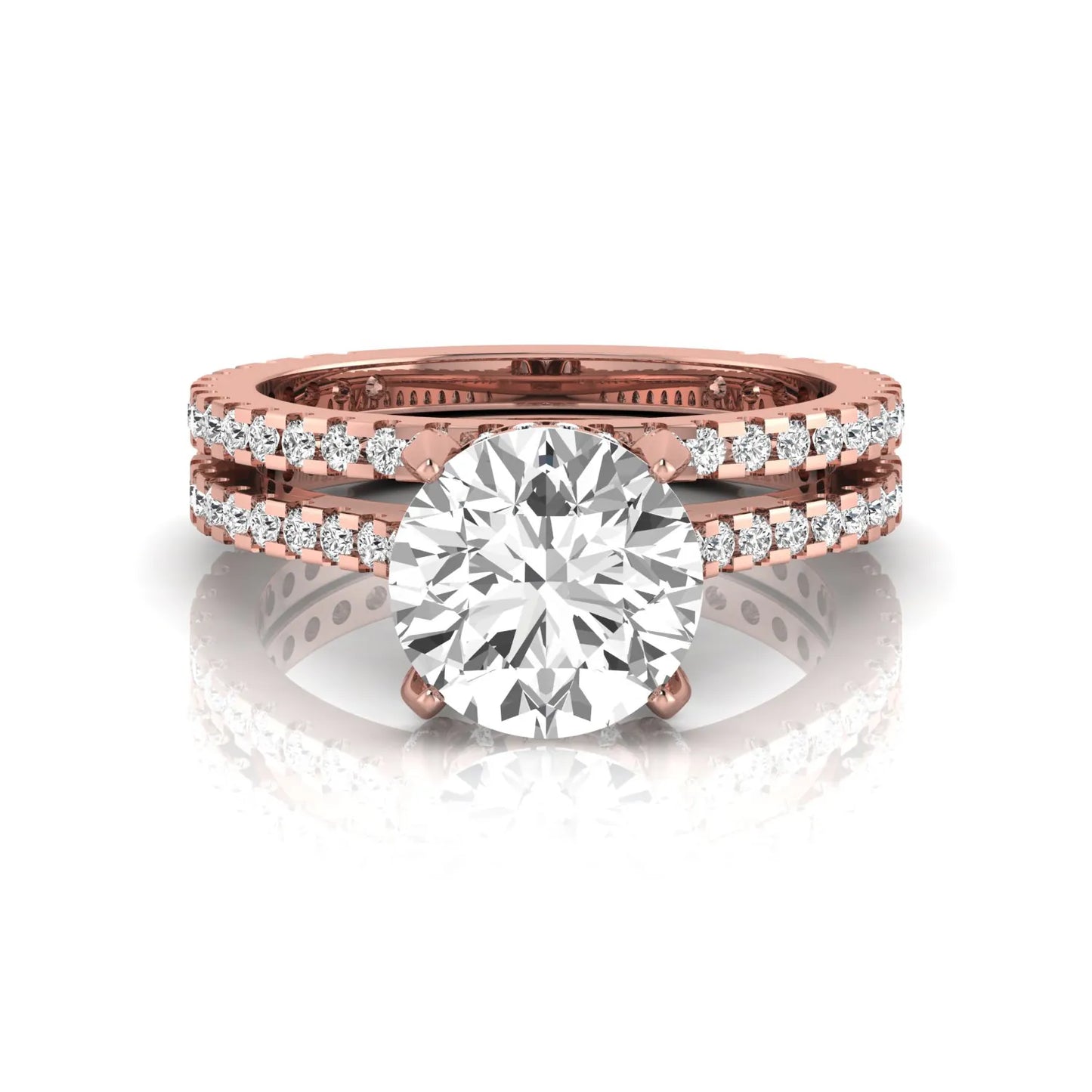 Round cut lab grown diamond bridal ring set featuring an IGI certified center diamond with matching pavé diamond wedding band in a classic four-prong setting in rose gold
