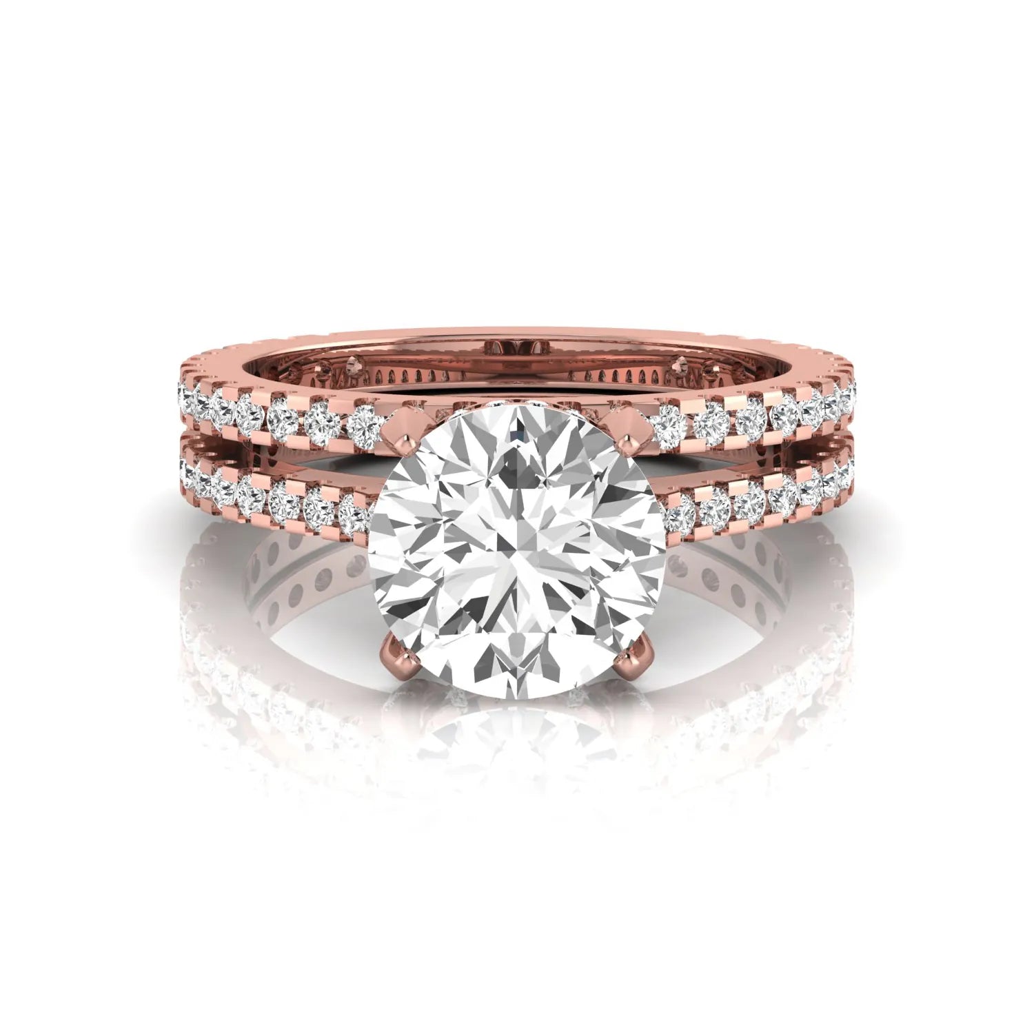 Round cut lab grown diamond bridal ring set featuring an IGI certified center diamond with matching pavé diamond wedding band in a classic four-prong setting in rose gold