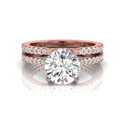 Round cut lab grown diamond bridal ring set featuring an IGI certified center diamond with matching pavé diamond wedding band in a classic four-prong setting in rose gold