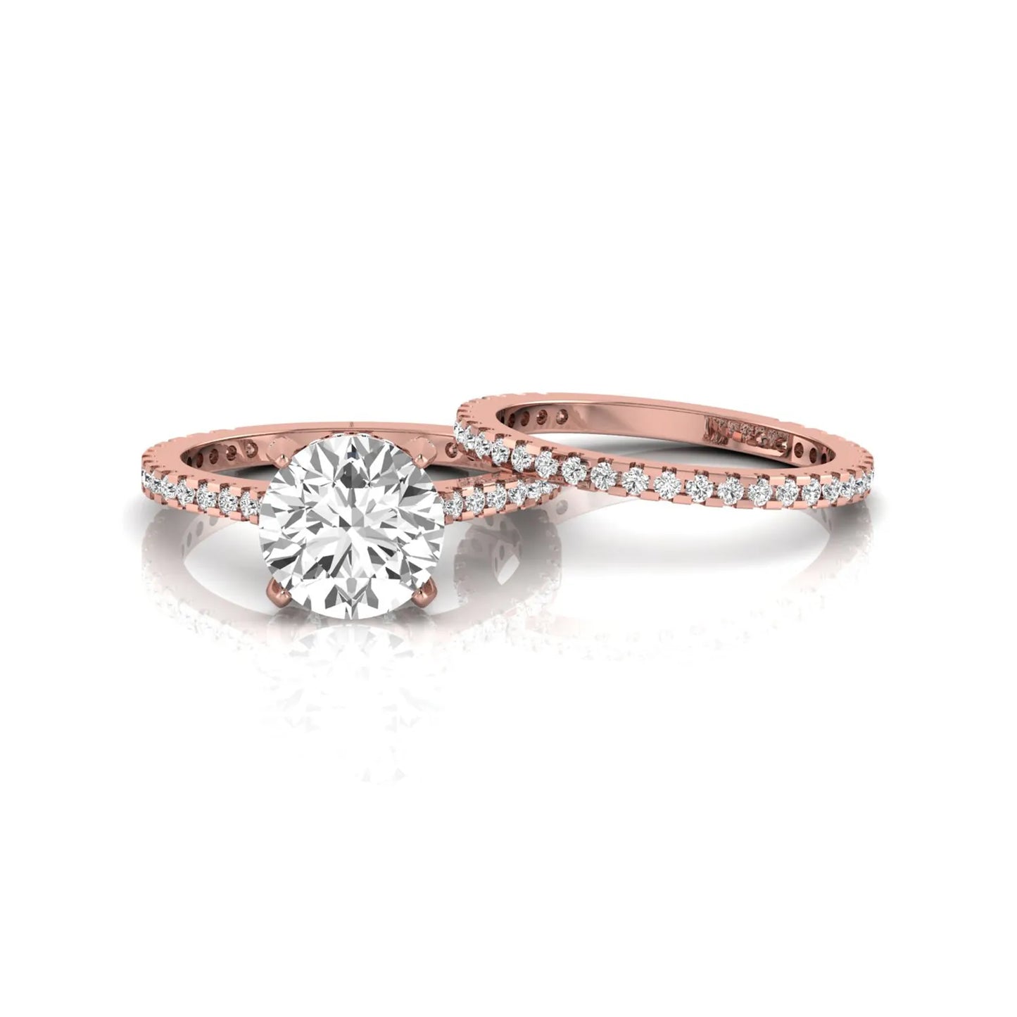 Round cut lab grown diamond bridal ring set featuring an IGI certified center diamond with matching pavé diamond wedding band in a classic four-prong setting in rose gold