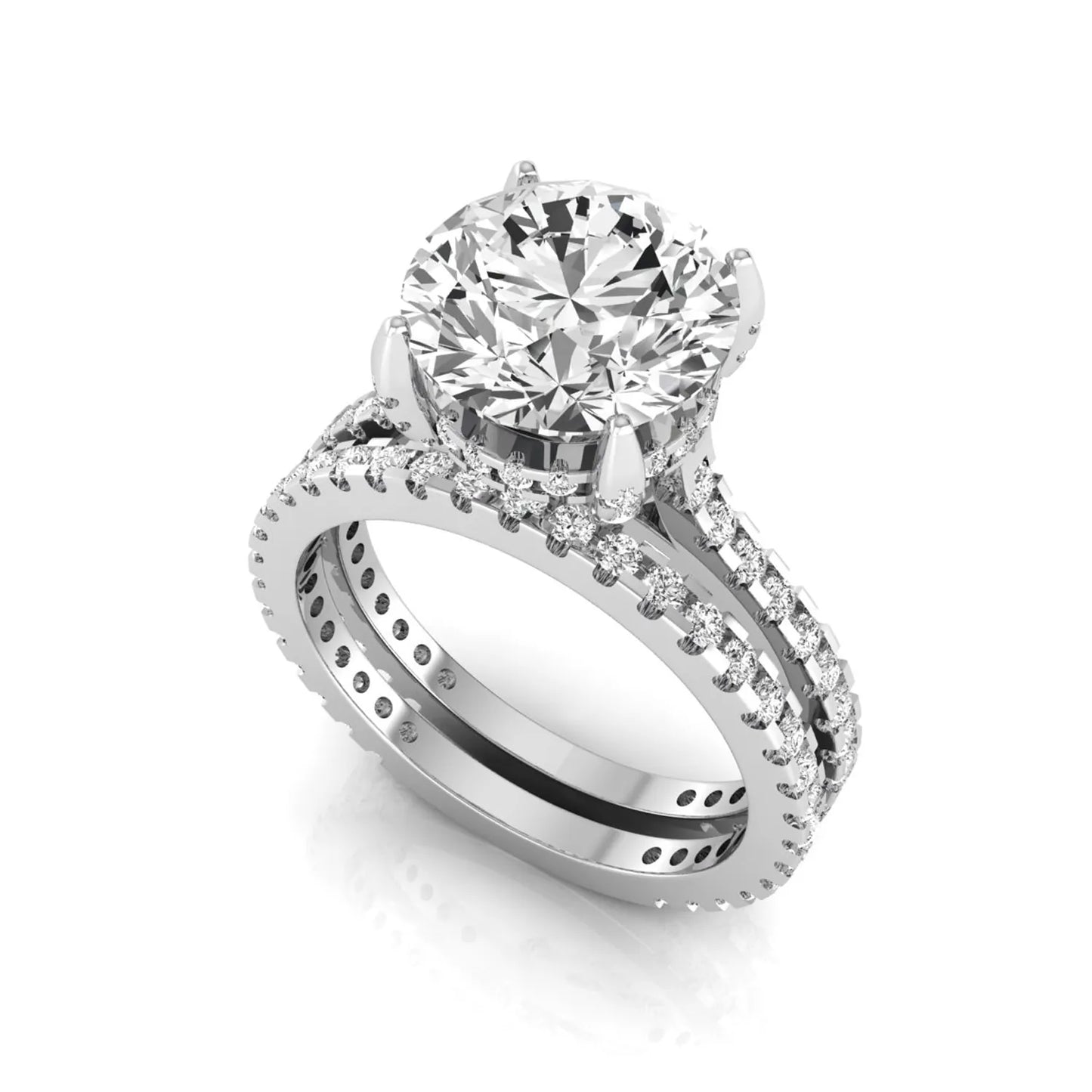 Round cut lab grown diamond bridal ring set featuring an IGI certified center diamond with matching pavé diamond wedding band in a classic four-prong setting in white gold