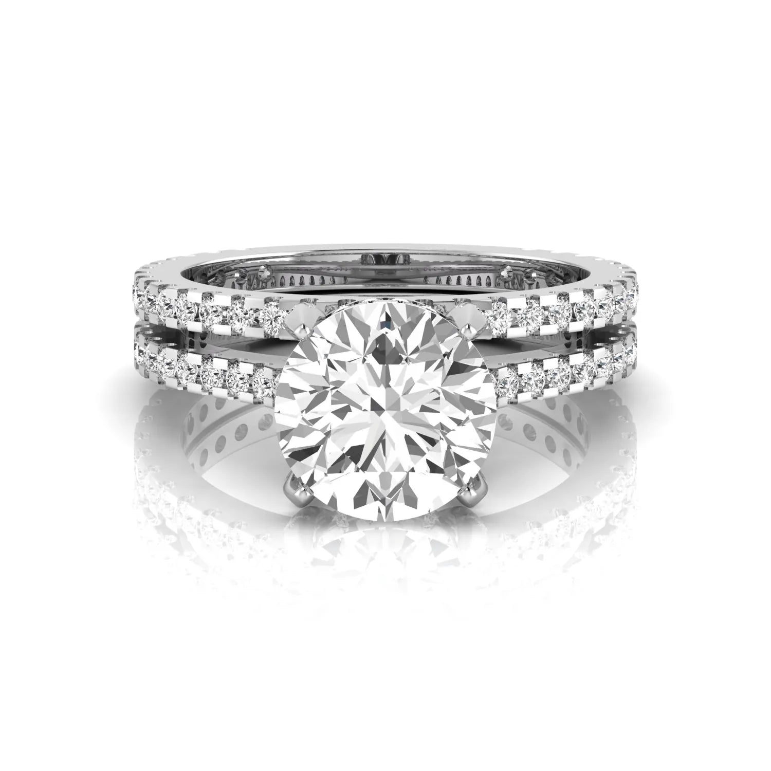 Round cut lab grown diamond bridal ring set featuring an IGI certified center diamond with matching pavé diamond wedding band in a classic four-prong setting in white gold