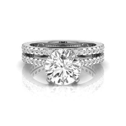 Round cut lab grown diamond bridal ring set featuring an IGI certified center diamond with matching pavé diamond wedding band in a classic four-prong setting in white gold