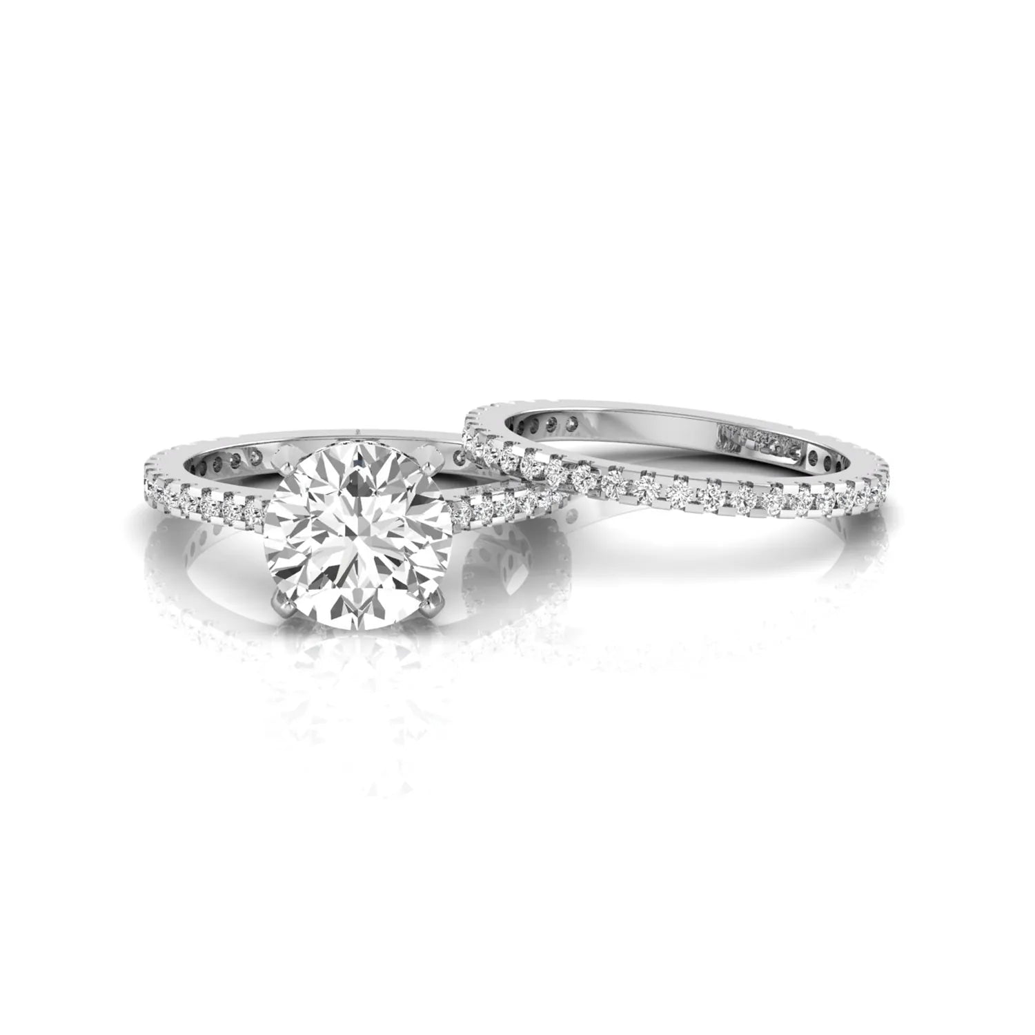 Round cut lab grown diamond bridal ring set featuring an IGI certified center diamond with matching pavé diamond wedding band in a classic four-prong setting in white gold
