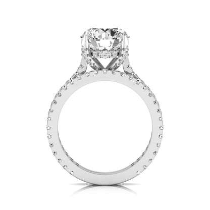 Round cut lab grown diamond bridal ring set featuring an IGI certified center diamond with matching pavé diamond wedding band in a classic four-prong setting in white gold