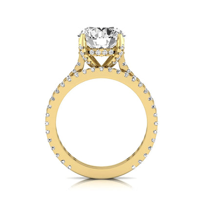 Round cut lab grown diamond bridal ring set featuring an IGI certified center diamond with matching pavé diamond wedding band in a classic four-prong setting in yellow gold
