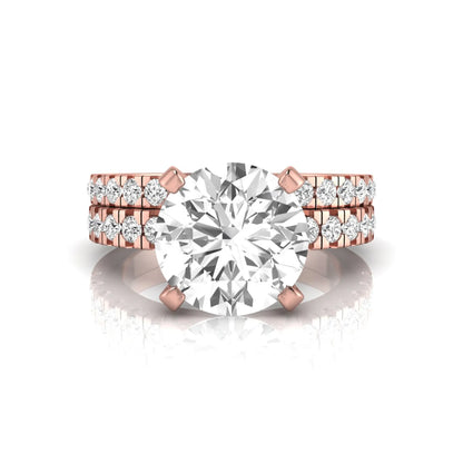Round pavé lab grown diamond bridal ring set featuring a 2.75 carat IGI certified round center diamond with matching pavé diamond wedding band in a rose gold design.