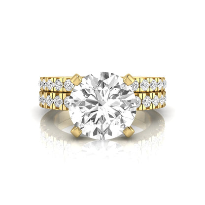 Round pavé lab grown diamond bridal ring set featuring a 2.75 carat IGI certified round center diamond with matching pavé diamond wedding band in a yellow gold design.