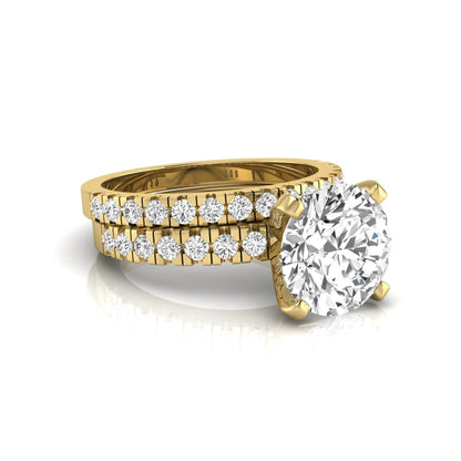 Round pavé lab grown diamond bridal ring set featuring a 2.75 carat IGI certified round center diamond with matching pavé diamond wedding band in a yellow gold design.