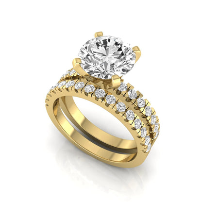 Round pavé lab grown diamond bridal ring set featuring a 2.75 carat IGI certified round center diamond with matching pavé diamond wedding band in a yellow gold design.