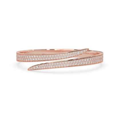 Round pavé set lab grown diamond bypass open cuff bangle bracelet with elegant sculptural crossover silhouette in rose gold metal tone