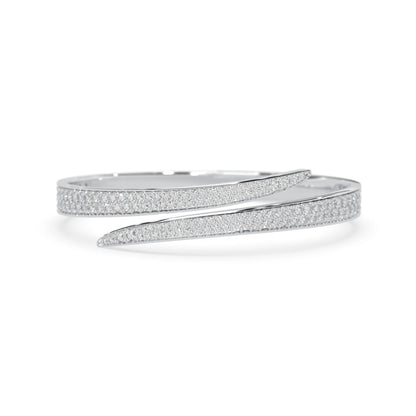 Round pavé set lab grown diamond bypass open cuff bangle bracelet with elegant sculptural crossover silhouette in white gold metal tone