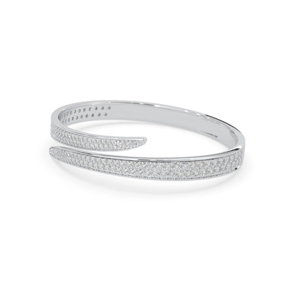 Round pavé set lab grown diamond bypass open cuff bangle bracelet with elegant sculptural crossover silhouette in white gold metal tone